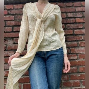 Cream silk blouse with dramatic sash
